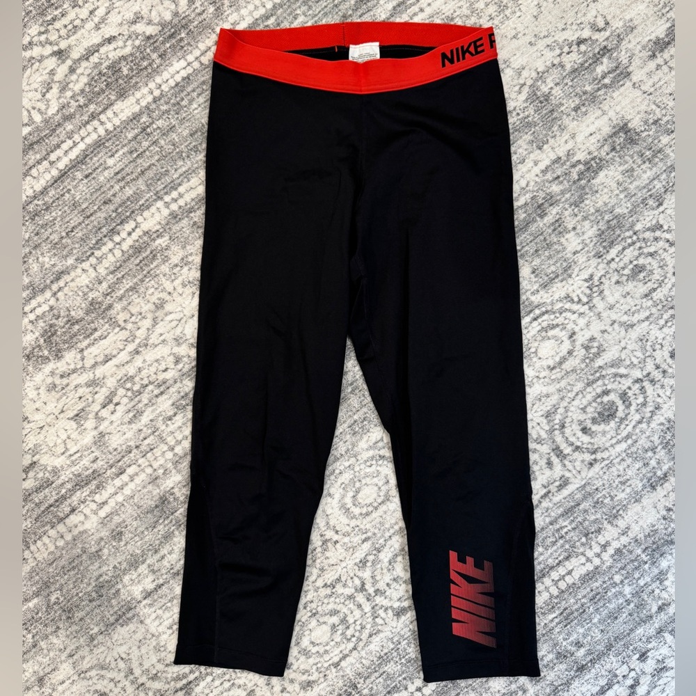 Nike Women’s Cropped Leggings in Black with Red Trim